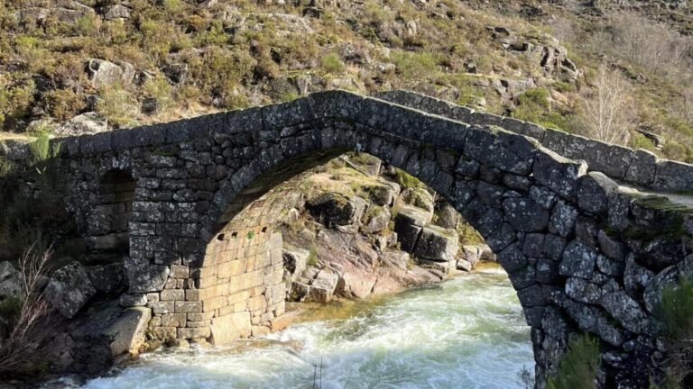 Old stone bridge over a mountain river in Peneda-Gerês