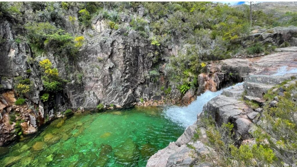 Emerald lagoon and waterfall in Peneda-Gerês National Park