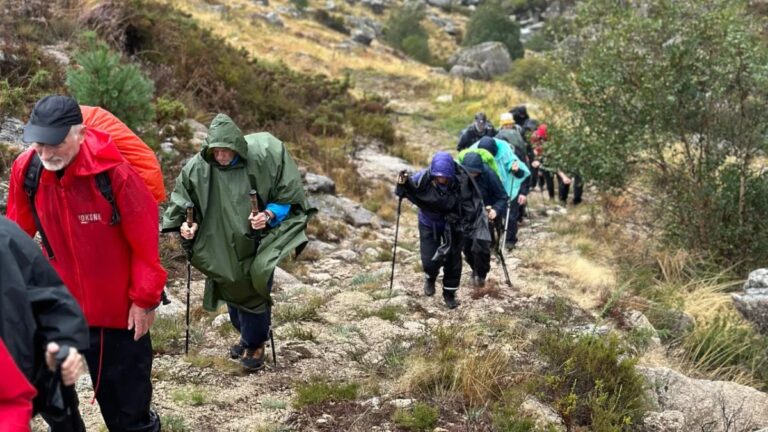 Guided hiking group on a mountain trail in Castro Laboreiro