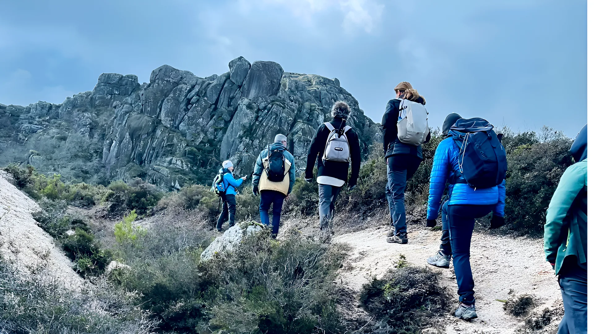 Guided hike on a granite trail, Peneda-Gerês Small group of hikers on a guided walk towards granite peaks in Peneda-Gerês National Park, Northern Portugal