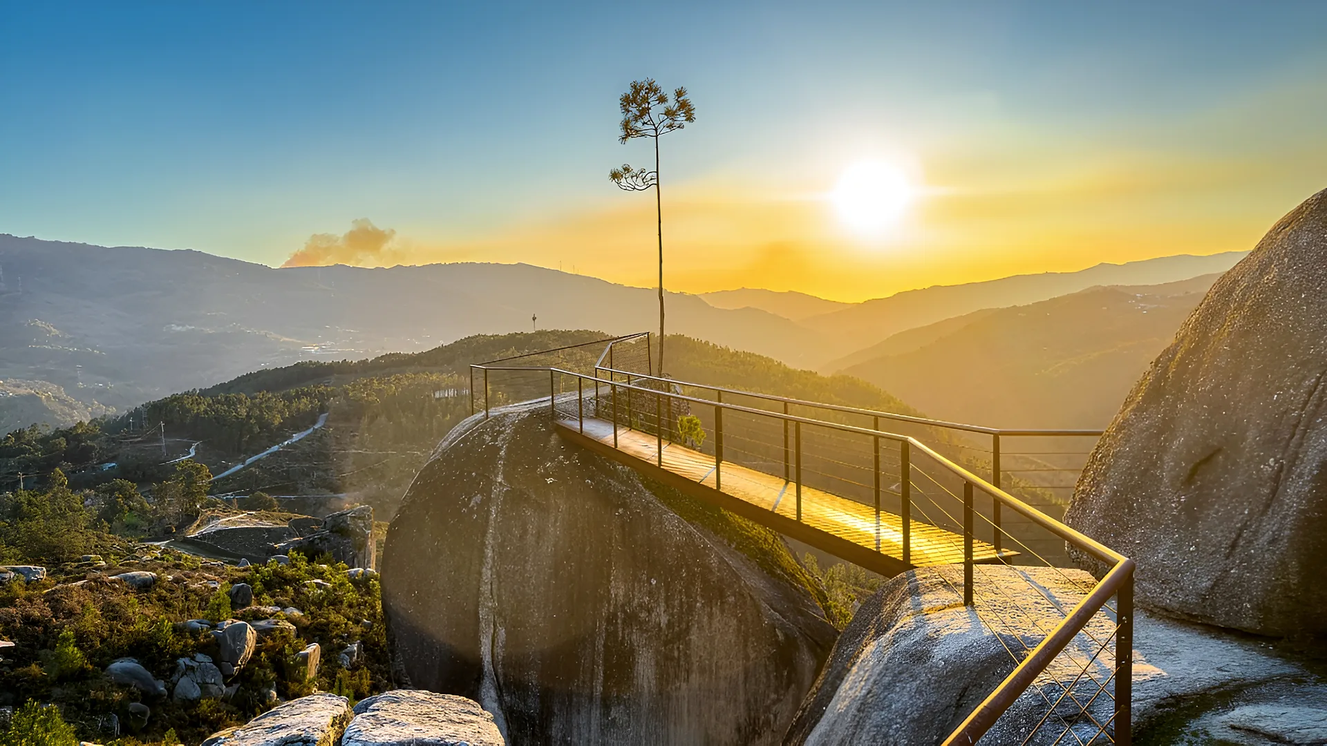 Viewpoint walkway at sunset Wooden viewpoint walkway over granite boulders at sunset in the mountains of Northern Portugal