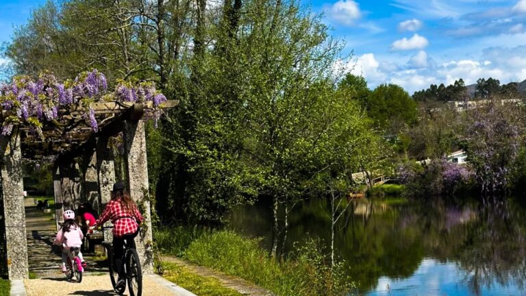 Mountain bike by a river near a village in Gerês