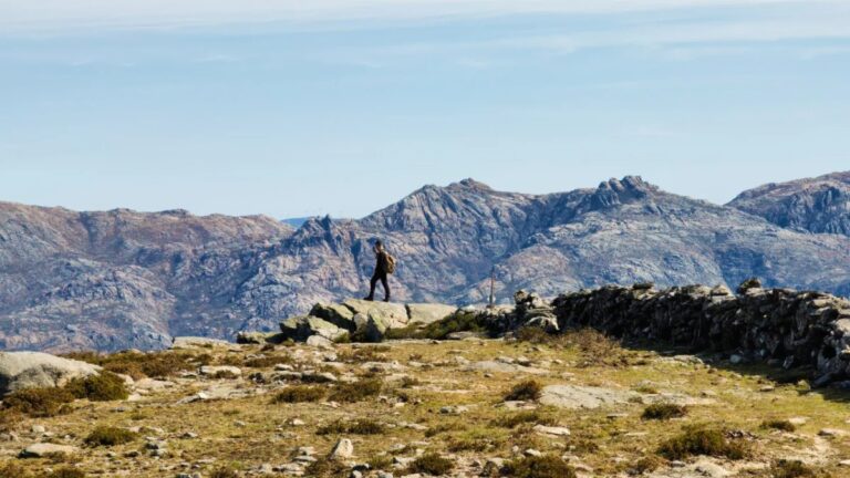 Hiker on a granite viewpoint in the Peneda mountains